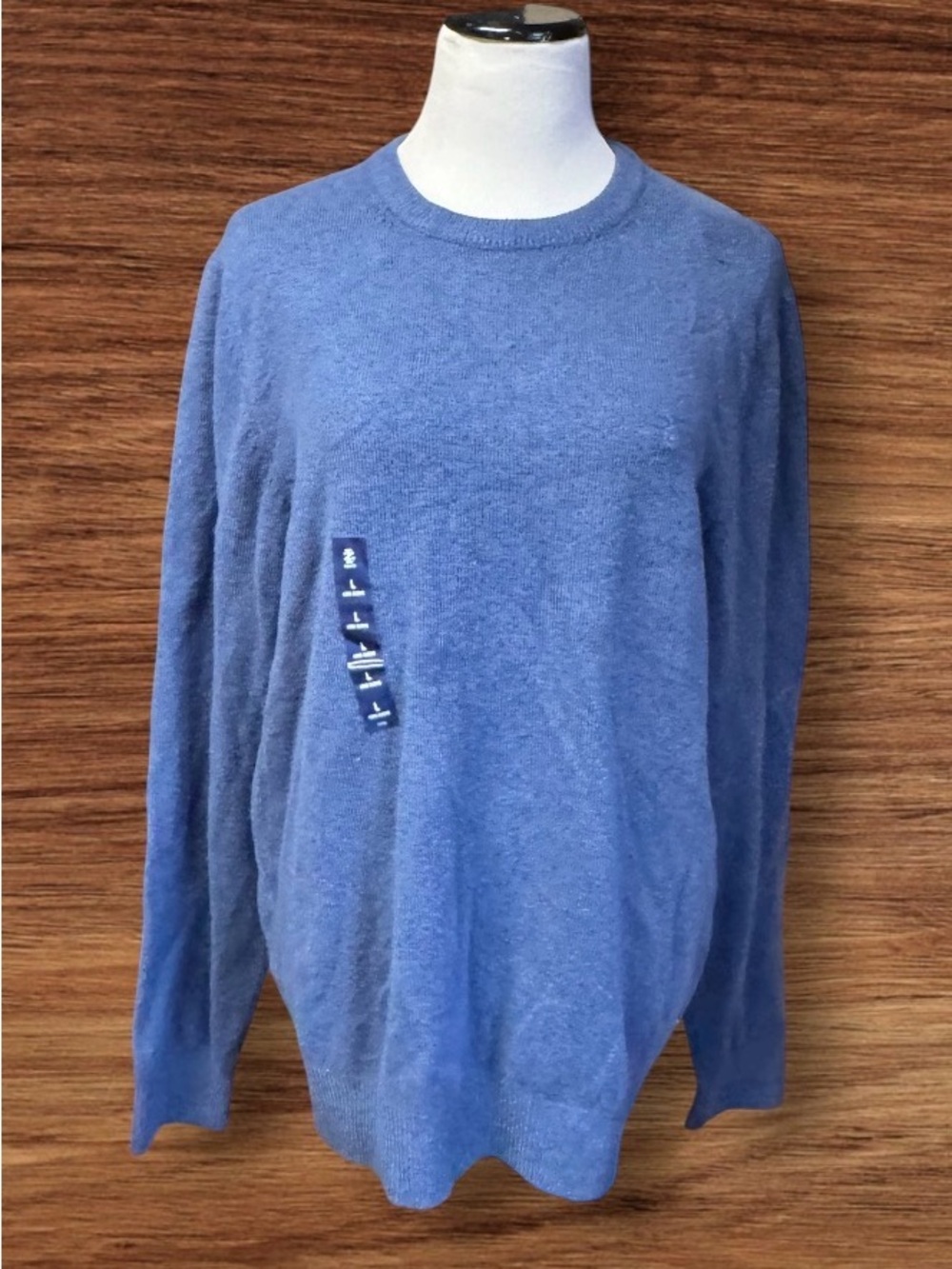 NWT IZOD sweater pictured is a blue, long-sleeved crewneck pullover